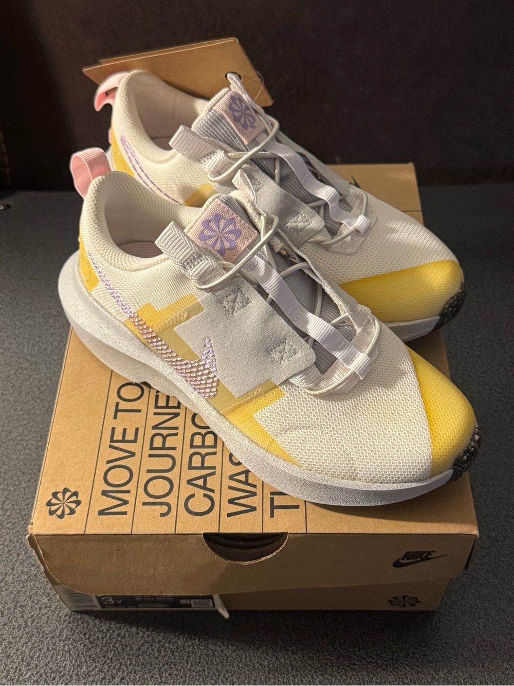 Nike Crater Impact PS
Size 3Y White with Yellow Accents and Purple